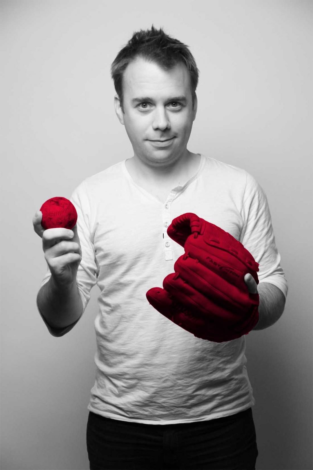 Image of Jeremy McCracken and his "q media red" baseball glove and ball. He is a lifelong fan of baseball.