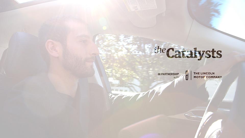 The opening frame of this series, featuring a man behind the wheel of a Lincoln. The test says "the catalysts" with a Lincoln logo