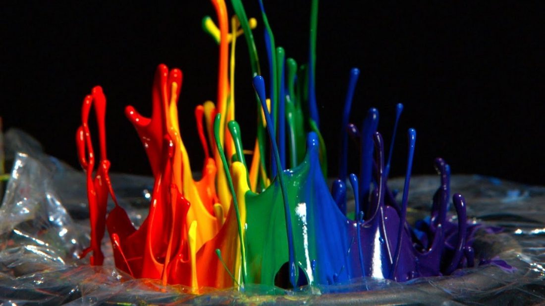 video marketing inspiration from the slo-mo guys video - rainbow colored paint bounces up from a speaker in a beautiful slo-motion image